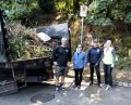 Volunteers removing fire fuel in the Firewise program.