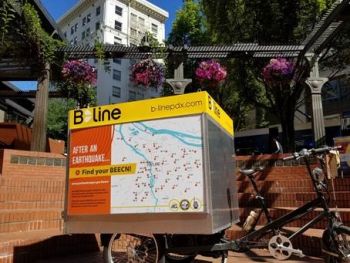 Picture of a cargo bike with a BEECN map on the side of the trailer