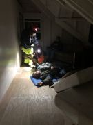 Rescuers find Survivors in an upper floor during Operation Newberg. Photo by Glenn Devitt.