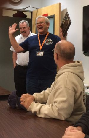 Ed Rentz receiving a plaque for his long-time leadership with Laurelhurst NET. Photo by Ernest Jones.